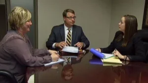 Attorneys meeting with a client.