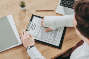 Man filling a workers' compensation claim.